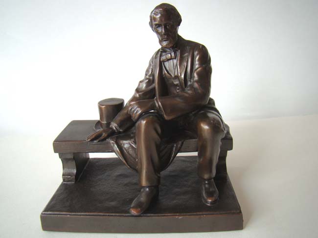 A Wonderful pair of Antique Bookends depicting Abraham Lincoln sitting on a bench circa 1926